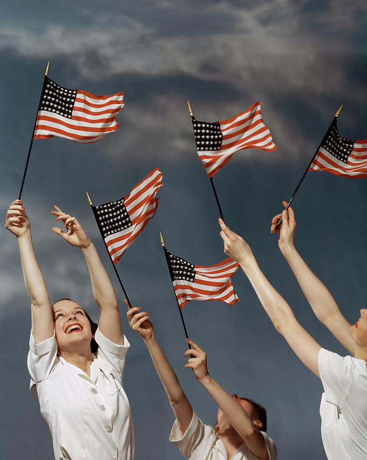 Young Women Waving American Flags Photograph by Roger Kahan