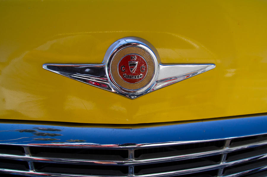 Checker Cab Photograph - 1971 Checker Cab Hood Badge by Roger Mullenhour