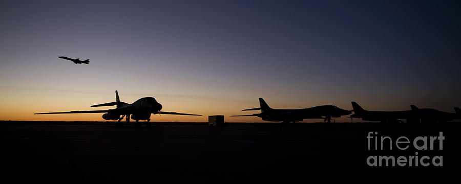 A B-1b Lancer Takes Off At Sunset Photograph
