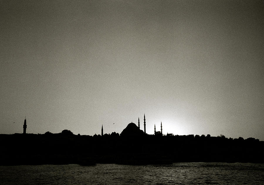 A twilight view across the Golden Horn in Istanbul in Turkey #1 Photograph by Shaun Higson