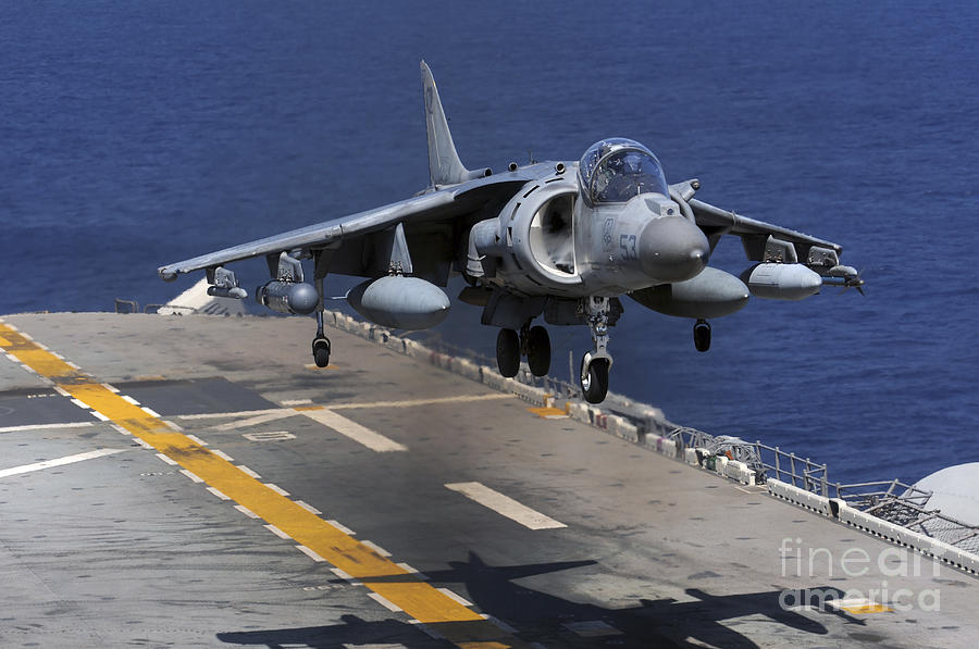 Transportation Photograph - An Av-8b Harrier Jet Lands #1 by Stocktrek Images