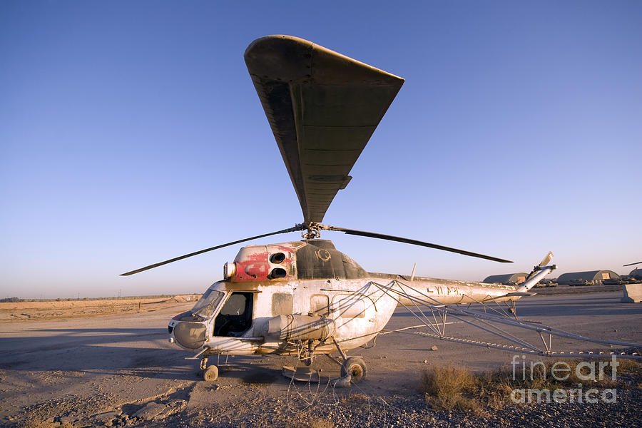 Helicopter Photograph - An Iraqi Helicopter Sits On The Flight #1 by Terry Moore
