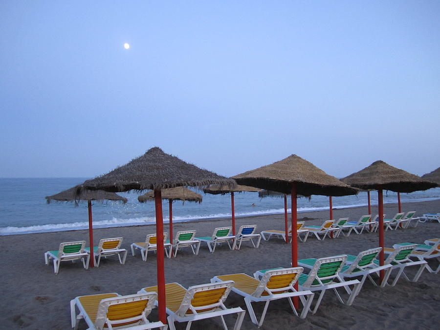 Beach Umbrellas and Chairs Moon Lit Costa Del Sol Spain #1 Photograph by John Shiron