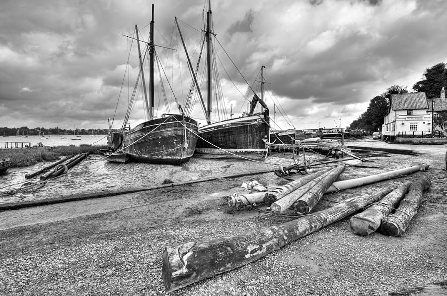 Boats and logs at Pin Mill  #2 Photograph by Gary Eason