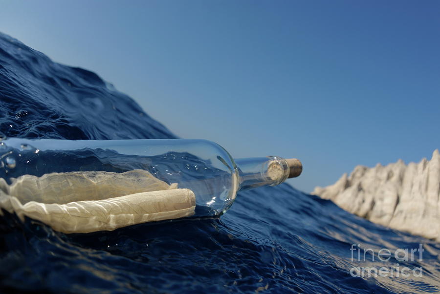 Bottle containing message floating in sea #1 Photograph by Sami Sarkis