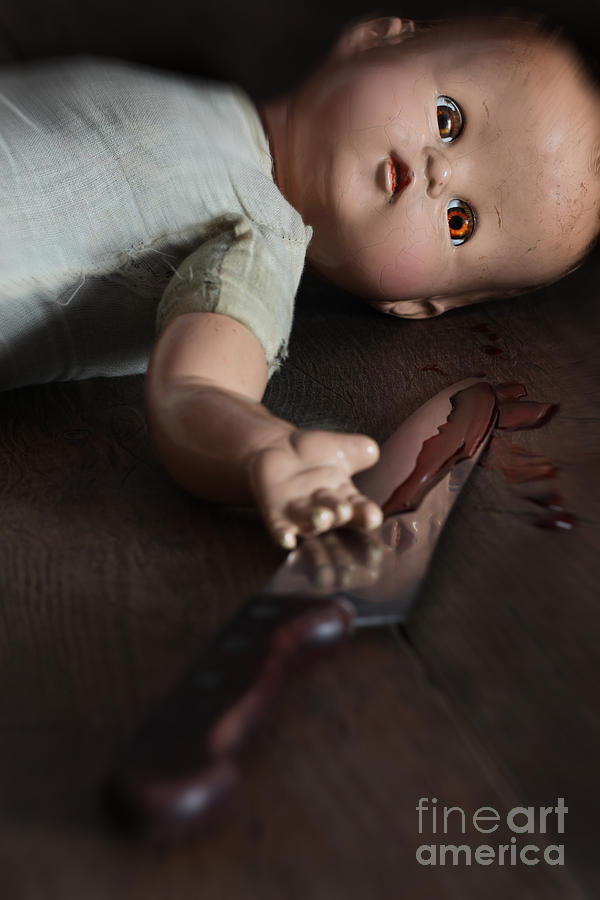Creepy doll with bloody knife  #1 Photograph by Sandra Cunningham