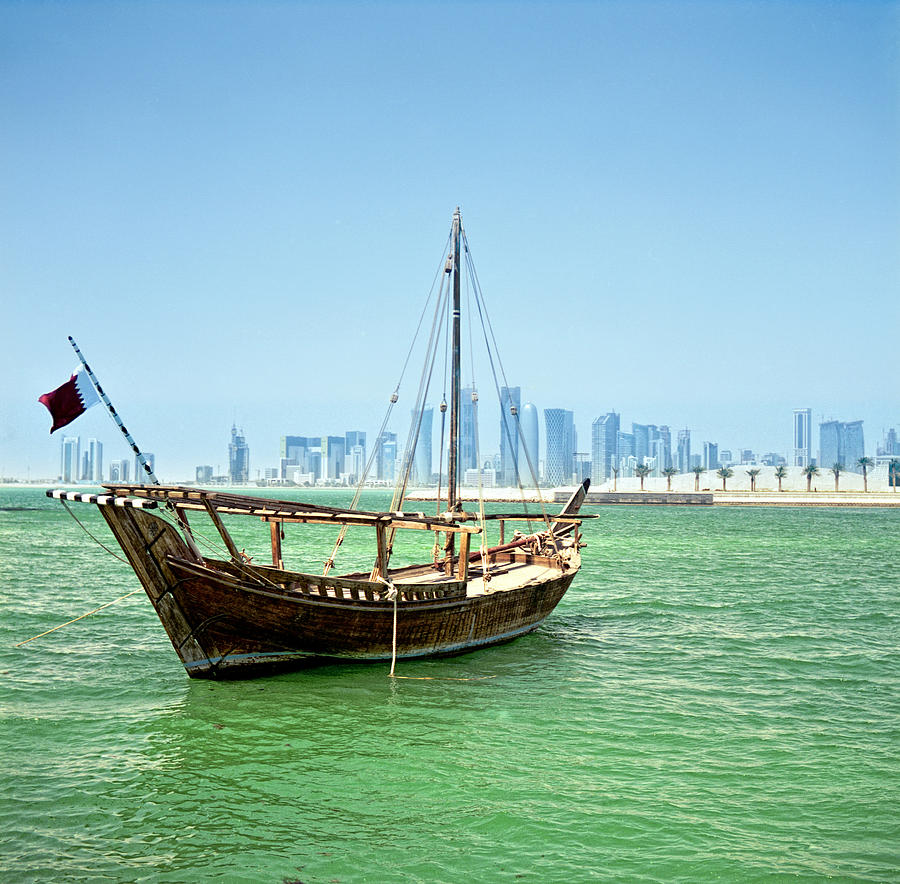 Dhow and Doha skyline #1 Photograph by Paul Cowan