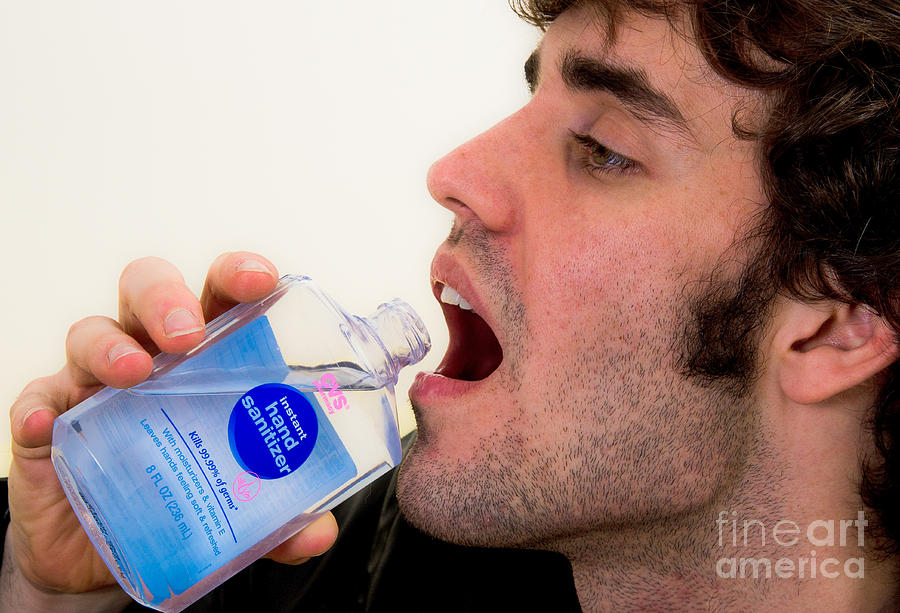 Drinking Hand Sanitizer #1 Photograph by Photo Researchers
