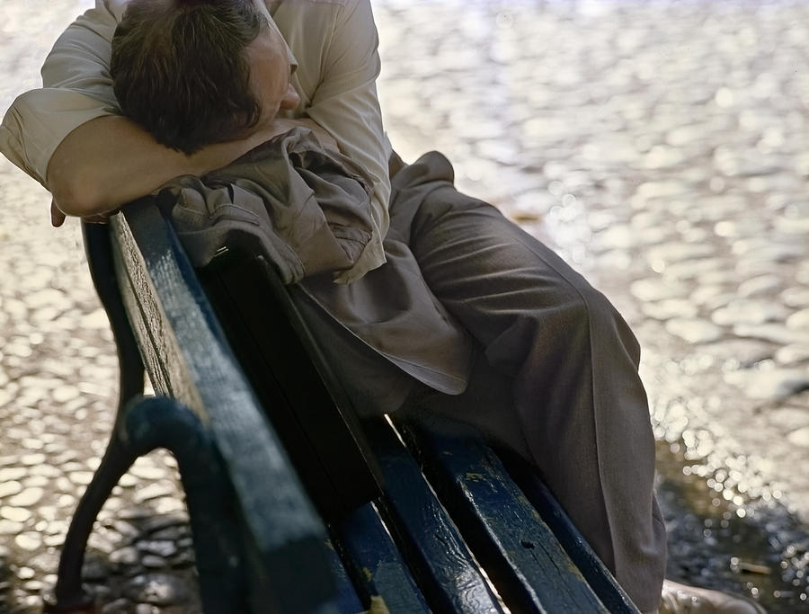 Drunken man sleeping on a blue bench #1 Photograph by Juan Carlos Ferro Duque