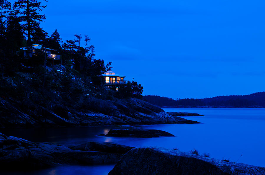 Illuminated cabin in the dark at the seaside #1 Photograph by U Schade