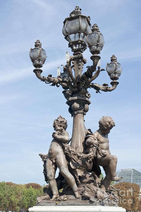 Lamppost and statues on the bridge Alexandre III in Paris #1 Photograph by Fabrizio Ruggeri