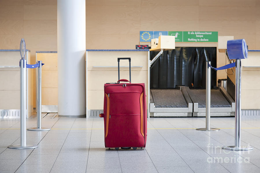 Luggage At An Airline Checkin Counter Photograph by Jaak Nilson