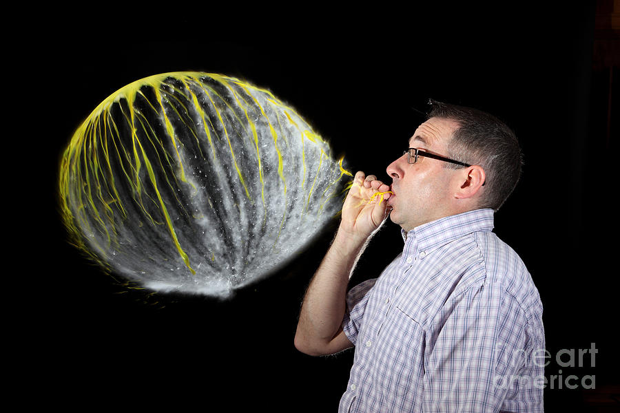 Man Over Inflating Balloon Photograph By Ted Kinsman Fine Art America