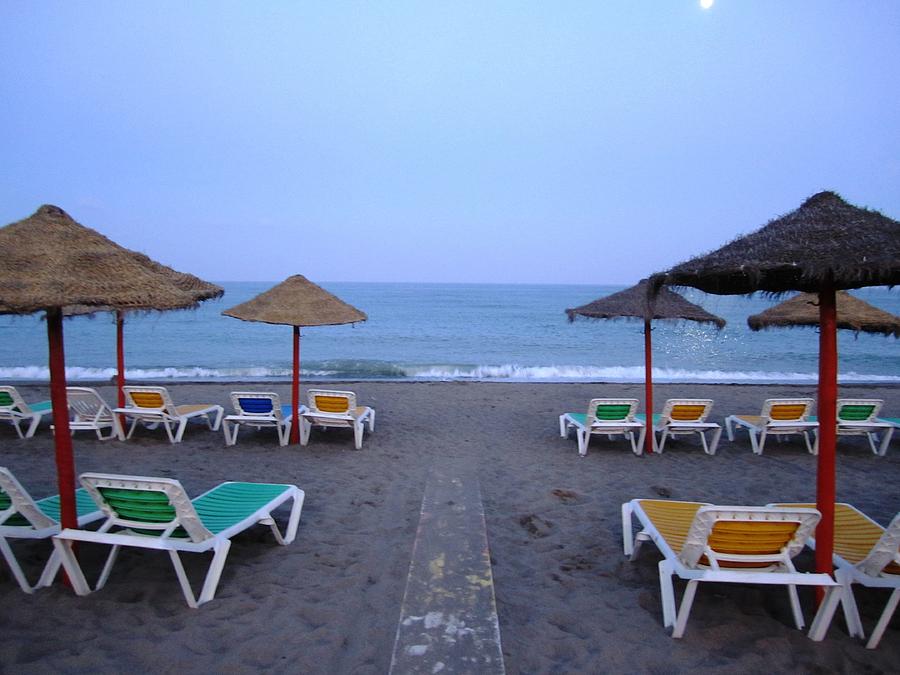 Moon Lit Beach Umbrellas and Chairs Costa Del Sol Spain #1 Photograph by John Shiron