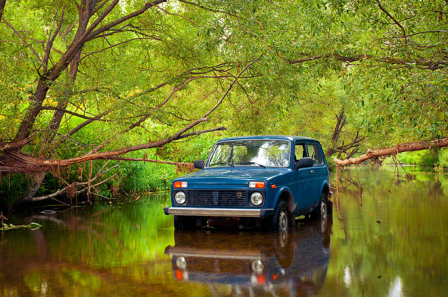 SUV in river Photograph by Nikolay Denisov - Fine Art America