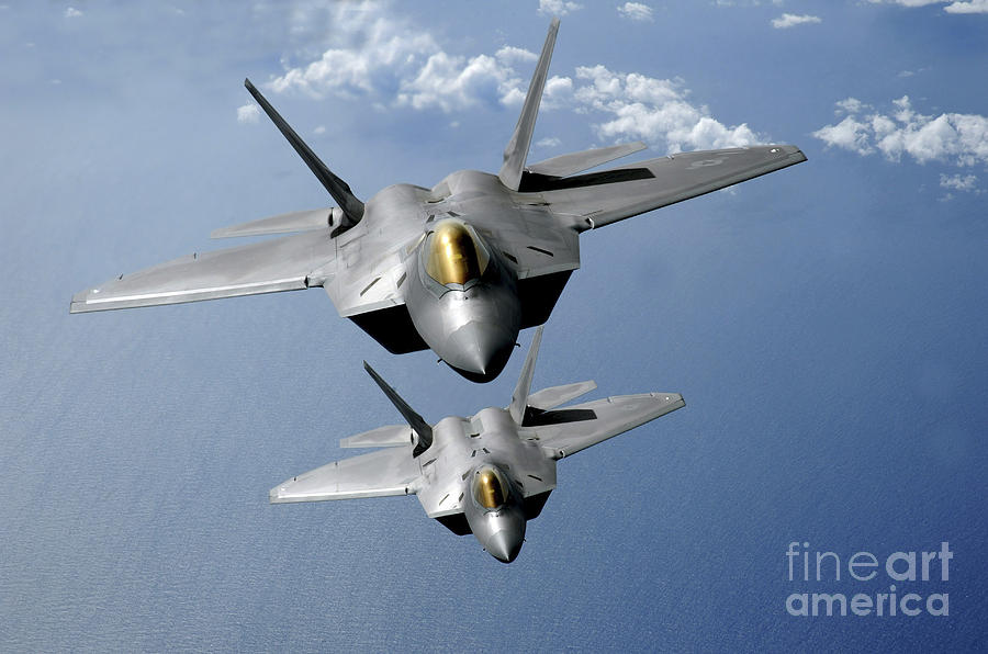 Two F-22 Raptors Fly Over The Pacific #1 Photograph by Stocktrek Images
