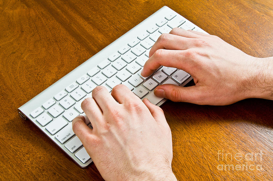 Typing On A Wireless Keyboard #1 Photograph by Photo Researchers