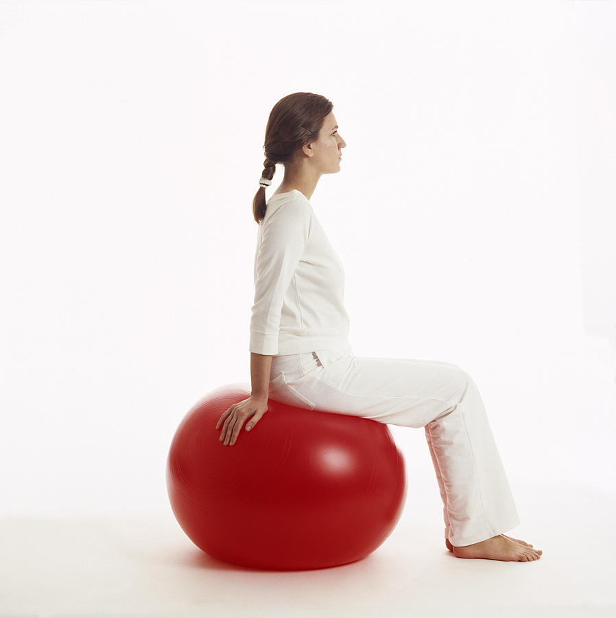 sitting on a swiss ball