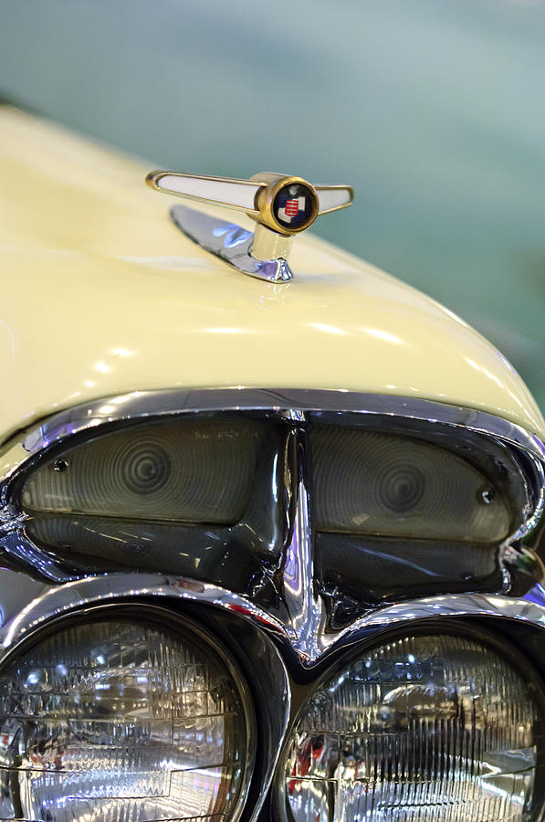 1957 Mercury Turnpike Cruiser Headlight Emblem Photograph by Jill Reger