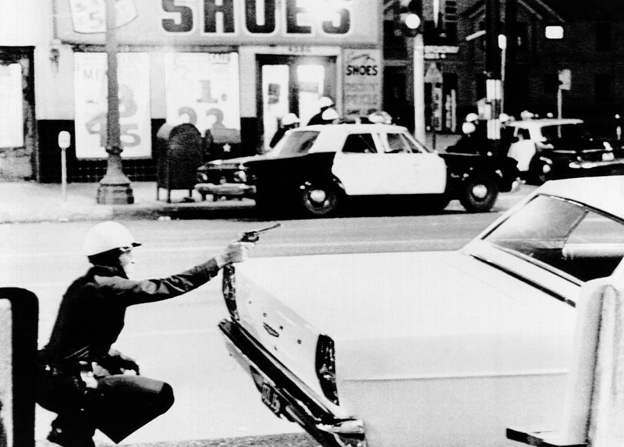 1965 Watts Riots. A Policeman Aims by Everett