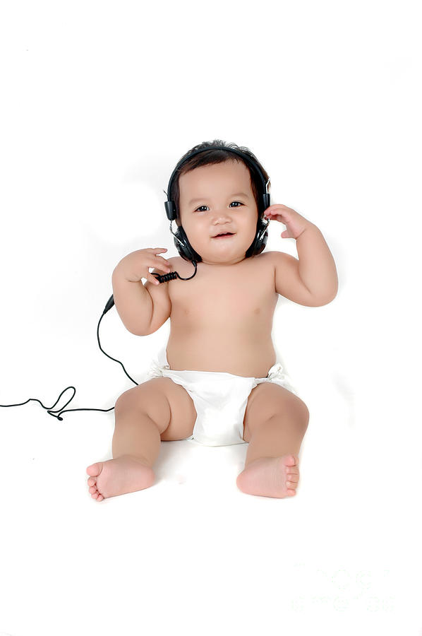 A Chubby Little Girl Listen To Music With Headphones Photograph