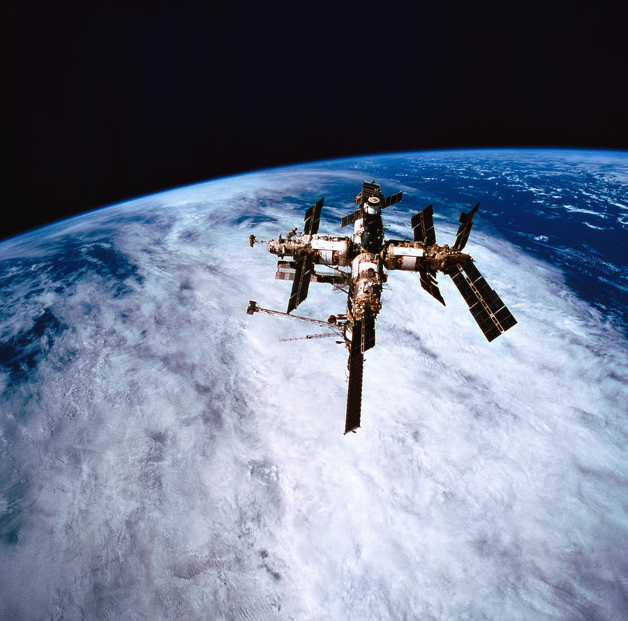 A Space Station In Orbit Above The Earth #2 Photograph by Stockbyte