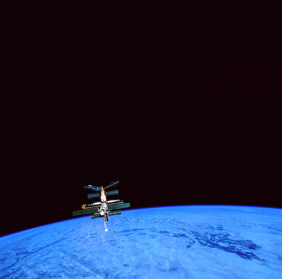 A Space Station Orbiting Above The Earth #2 Photograph by Stockbyte