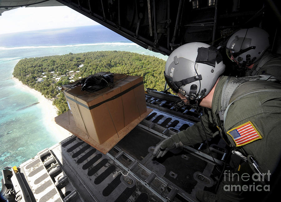 Airmen Push Out A Pallet Of Donated Photograph