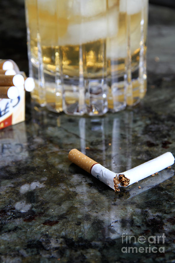 Alcohol And Cigarettes Photograph by Photo Researchers