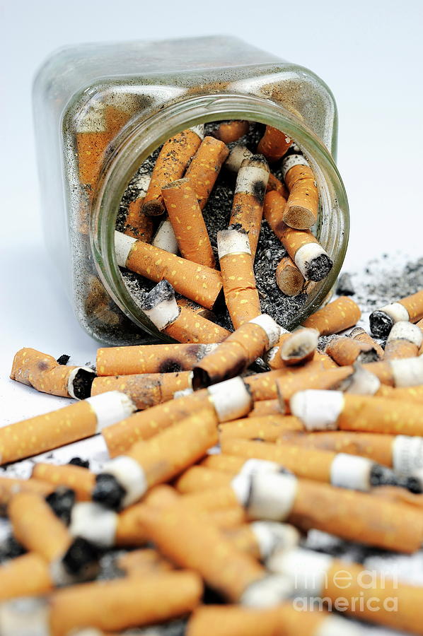 Jar Photograph - Jar overflowing with cigarette butts #2 by Sami Sarkis