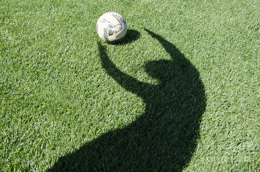 Shadow playing football #2 Photograph by Mats Silvan