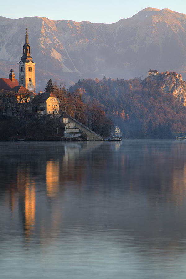 Dawn breaks over Lake Bled Photograph by Ian Middleton