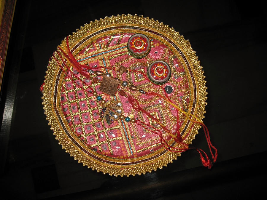 A bowl of rakhis in a decorated dish Photograph by Ashish Agarwal