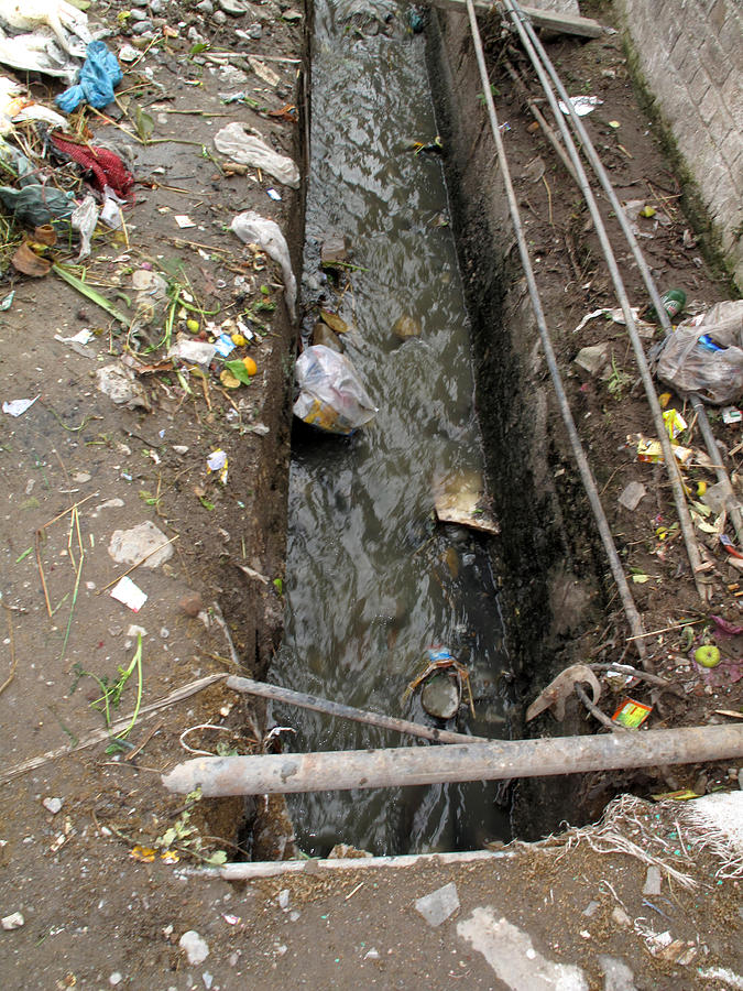 A dirty drain with filth all around it representing a health risk Photograph by Ashish Agarwal