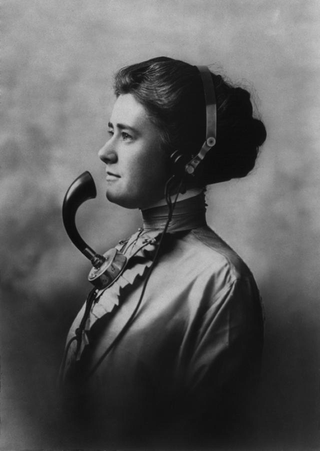 History Photograph - A Female Telephone Operator Wearing by Everett