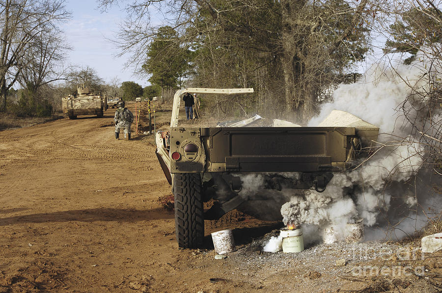 A Humvee Burns After A Simulated Photograph by Stocktrek Images