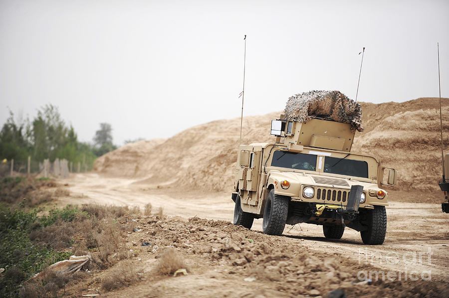 A Humvee Conducts Security Photograph by Stocktrek Images