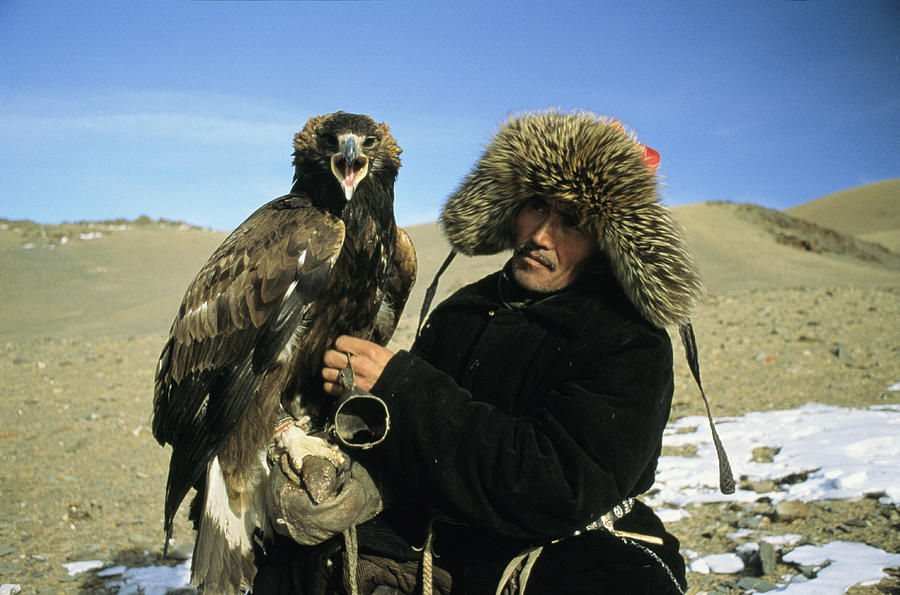 A Kazakh Eagle Hunter Poses Photograph by Ed George