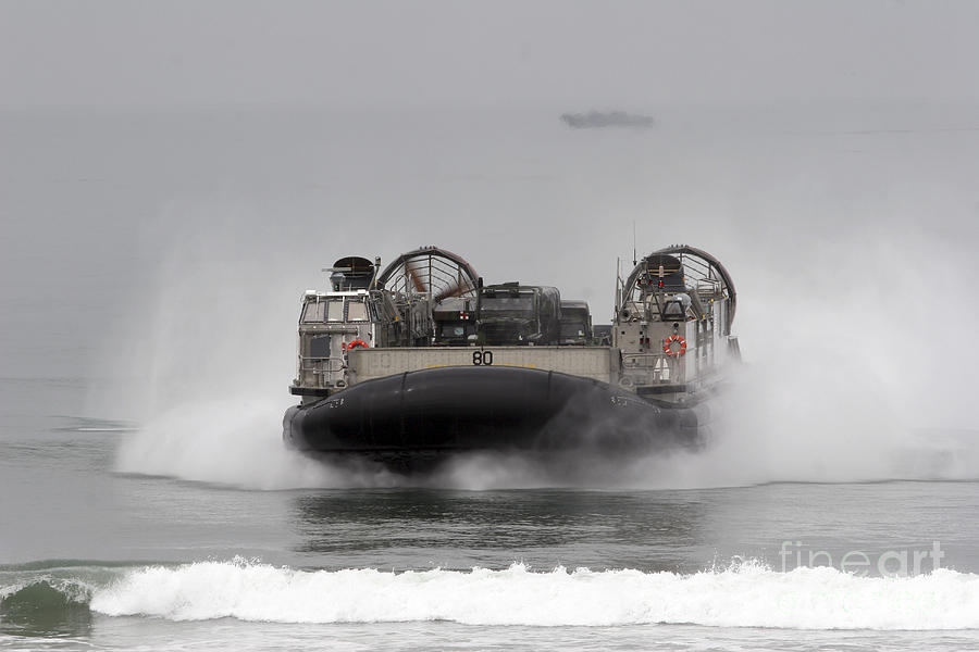 Boat Photograph - A Landing Craft Air Cushion Comes by Stocktrek Images