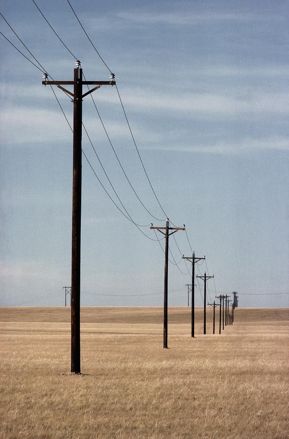 [Image: a-line-of-telephone-poles-travels-george-grall.jpg]