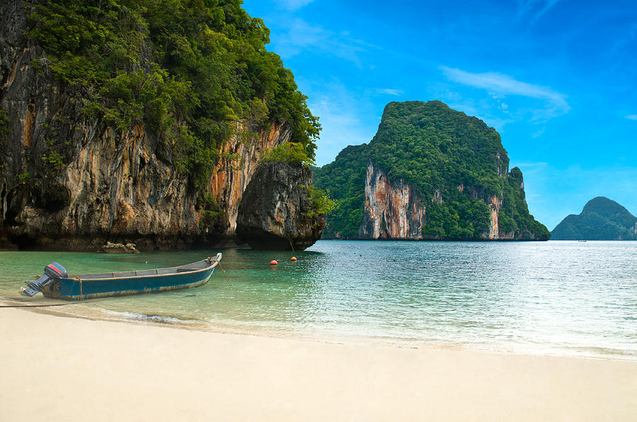 A long tail boat by the beach in Thailand  Photograph by U Schade