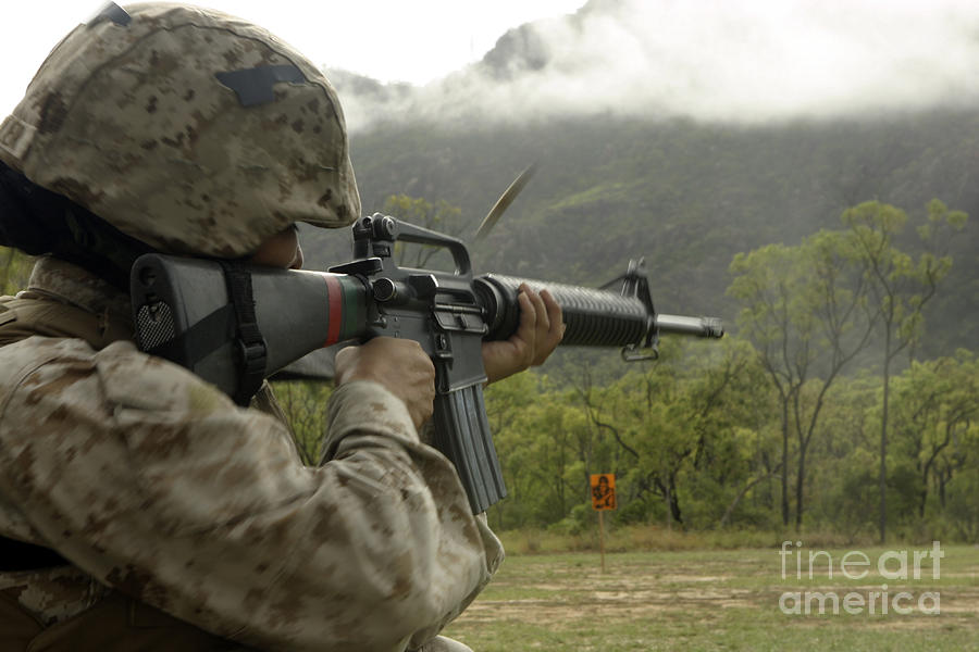 Shell Photograph - A Marine Conducts Drills With An M16-a2 by Stocktrek Images