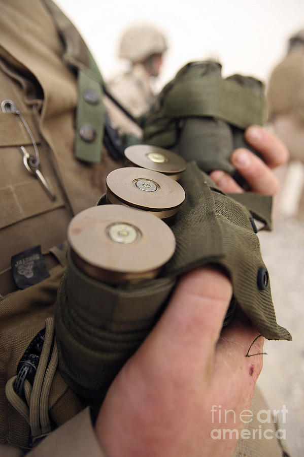 40mm Photograph - A Marine Cradles Handfuls Of 40 Mm by Stocktrek Images