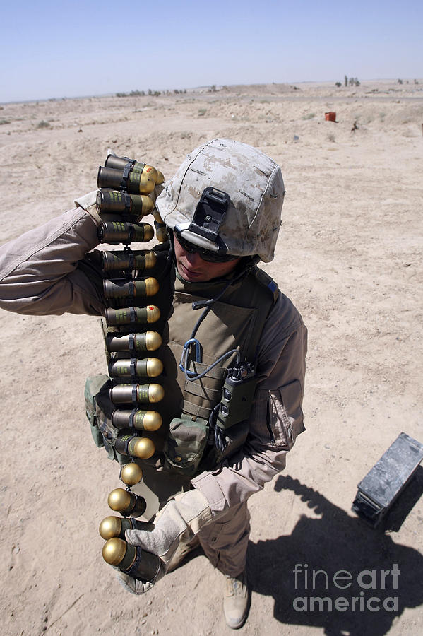 Can Photograph - A Marine Handles A String Of 40 Mm by Stocktrek Images