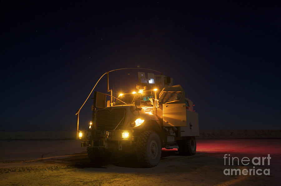A Maxxpro Mrap Vehicle With Running Photograph