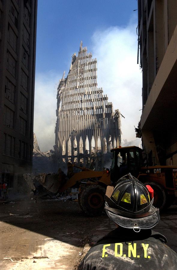 A New York City Firefighter Stands Photograph by Everett A New York City Firefighter Stands Photograph by Everett