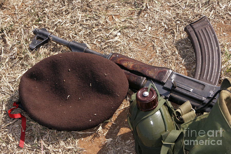 A Rifle, Military Cover And Canteen Photograph
