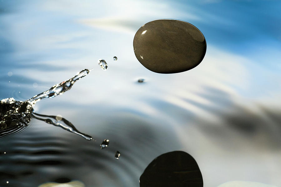 A Rock Skipping Across The Waters Photograph by Michael Durham A Rock Skipping Across The Waters Photograph by Michael Durham