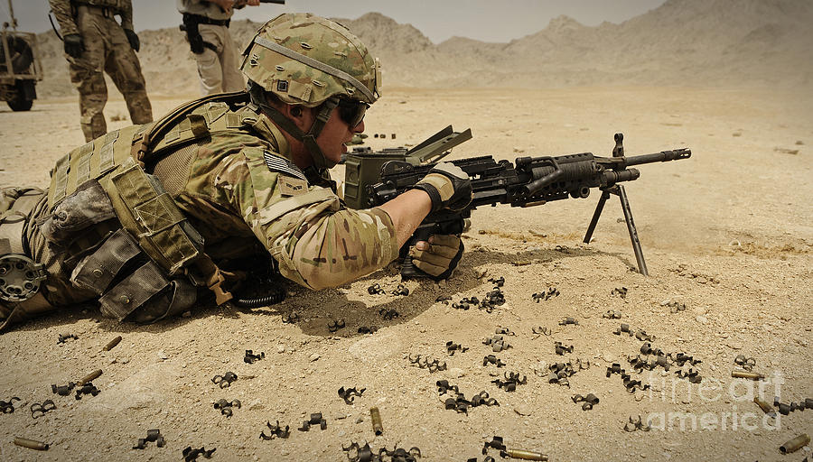 A Soldier Clears The Mk-48 Machine Gun Photograph by Stocktrek Images