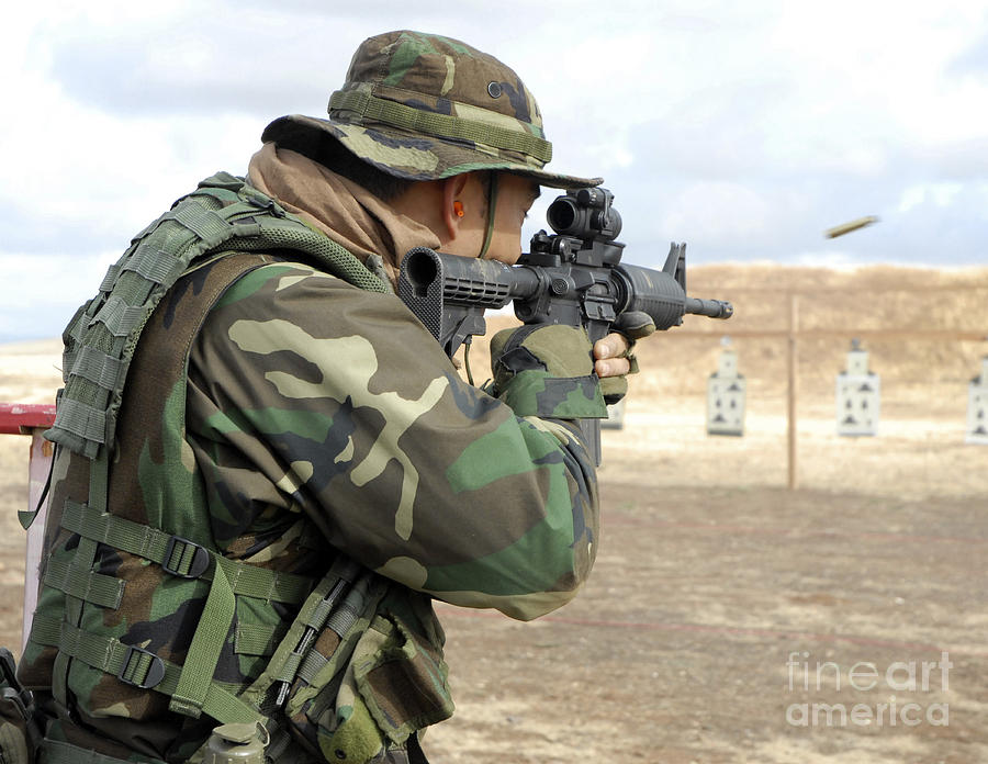 A Soldier Fires Rounds Down Range At An Photograph by Stocktrek Images